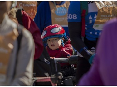 A youngster was waiting for the start of the 38th Tour de l'île de Montréal in Montreal on Sunday, June 4, 2023. He was there as part of an outing by The Quebec Foundation for the Blind.