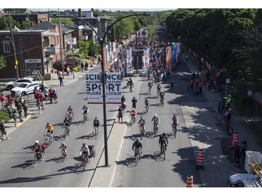 Cyclists ride along Rosemont Blvd. during the 38th Tour de l'île de Montréal in Montreal on Sunday, June 4, 2023.