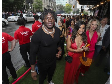 New York Jets defensive end Carl Lawson (left) at the Grand Prix Party 2023 at the Ritz Carlton on Friday, June 16, 2023.