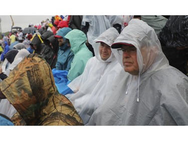 Racing fans watch a practice session in the rain at Circuit Gilles Villeneuve for Canadian Grand Prix on Saturday, June 17, 2023.