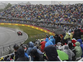 Racing fans watch a practice session in the rain at Circuit Gilles Villeneuve for Canadian Grand Prix on Saturday, June 17, 2023.