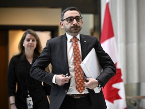 Federal Minister of Transport Omar Alghabra arrives at a news conference in Ottawa, on Monday, April 24, 2023. Some residents near Lac-Mégantic will have their land expropriated by the federal government to create a rail bypass in the community.