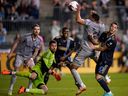 Philadelphia Union's Déniel Gazdag (10) and CF Montréal's George Campbell (24) collide during the second half of an MLS soccer match on Saturday, June 3, 2023, in Chester, Pa.