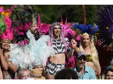 Participants take part in the Pride parade through the streets of downtown Denver on Sunday, June 25, 2023.