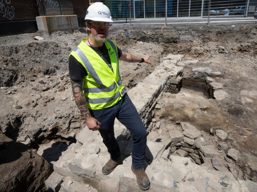Archeologist Martin Perron points to an archeological dig site
