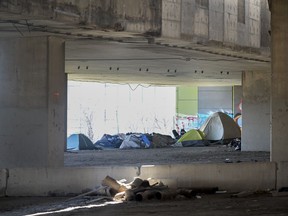 A tent city is shown beneath an overpass in Montreal on April 14, 2023.
