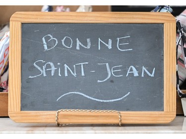 A sign wishing people a happy Saint-Jean-Baptiste day is shown in Montreal on Saturday, June 24, 2023.