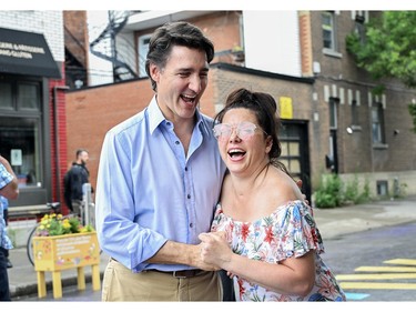 Prime Minister Justin Trudeau greets a woman during an event on Saint-Jean-Baptiste in Montreal, Saturday, June 24, 2023.
