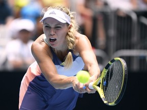 Caroline Wozniacki hits a tennis ball