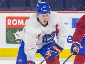 A hockey player in a white jersey