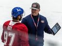 Montreal Canadiens top prospect Joshua Roy, left, speaks with Adam Nicholas, Canadiens Director of Hockey Development, at the Canadiens Development Camp at the Bell Sports Complex in Brossard on Monday July 3, 2023.
