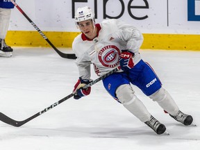 Filip Mesar skates on ice during practice
