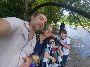 the defosses family take a selfie on a nature walk