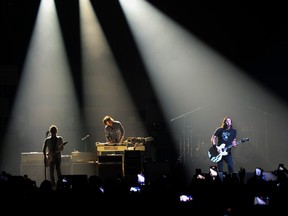 Dave Grohl (right), keyboardist Rami Jaffee and guitarist Chris Shiflett of Foo Fighters