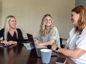 Meagan Somerville, centre, is the new executive director of West Island Community Shares. She is seen with Megan Brock, digital communications & social media, left, and Nynke Wijnalda, donor relations manager, at their Pointe-Claire office on Tuesday July 11, 2023.