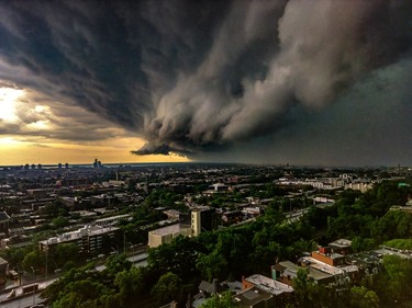 An aerial photo shows dark storm clouds over the city