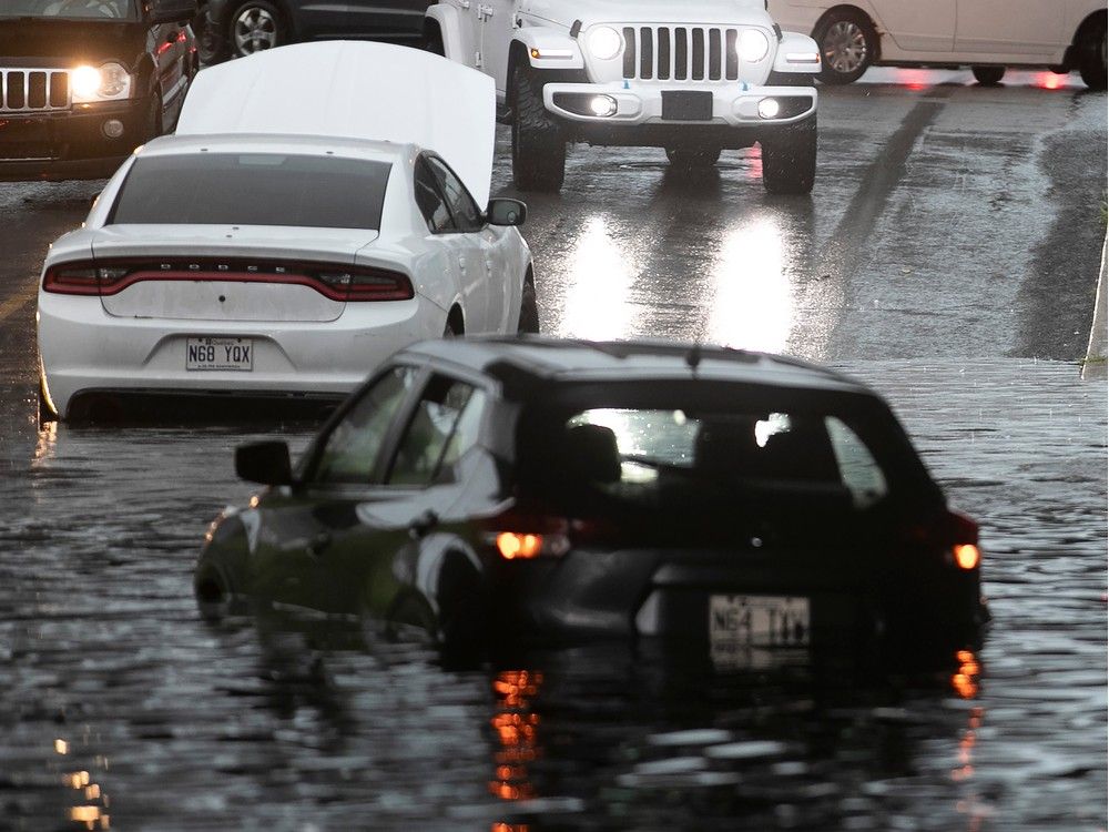 Cars stuck in a flooded underpass