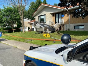 A crash July 20, 2023, was triggered by an apparent attempt by a motorist to avoid a Longueuil police traffic stop ended with an overturned car on the front lawn of a Brossard bungalow.