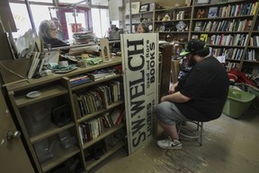 Photo of two men sitting in a bookstore