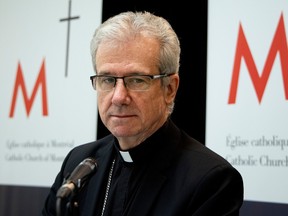 Archbishop Christian Lépine at a news conference