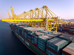 A container ship owned by China Shipping Container Lines Co. Ltd. is loaded at Jebel Ali Port, in Dubai, United Arab Emirates. Caisse de depot et placement du Quebec is looking at increasing its stake in the port.