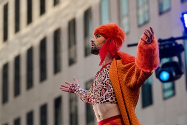 A circus performer clad in orange and leopard print
