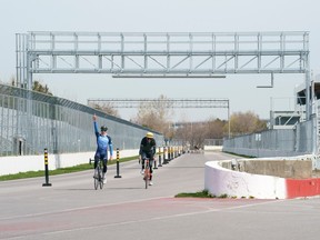 Cyclists are seen on the Circuit Gilles-Villeneuve in this 2021 file photo.