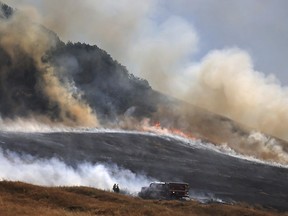 The San Antonio Fire spreads uphill west of Petaluma, Ca.,