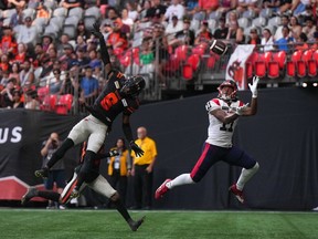 Montreal Alouettes' Kaion Julien-Grant (11) jumps and reaches for the ball behind B.C. Lions' T.J. Lee (6) but fails to make the catch in the end zone, during the second half of a CFL football game, in Vancouver, B.C., Sunday, July 9, 2023.