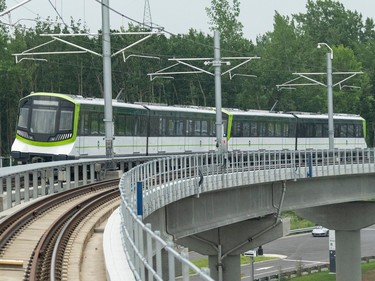A REM light rail system is seen on the tracks on July 28, 2023, in Brossard.