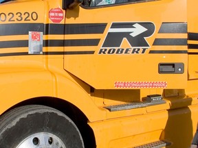 A Robert logo is seen on a truck door