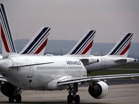 Air France planes are parked on the tarmac at Paris Charles de Gaulle airport, in Roissy, near Paris, Friday, May 17, 2019. A Montreal consortium has inked a deal to supply sustainable fuel to Air France-KLM.