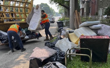 montreal workers clear big garbage storm debris