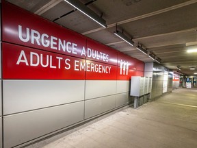 A sign in a parking garage reads "Adults emergency"