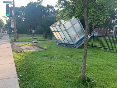 an overturned bus shelter