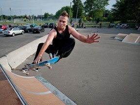 Benoit Langevin skates on a ramp set up on an asphalted area