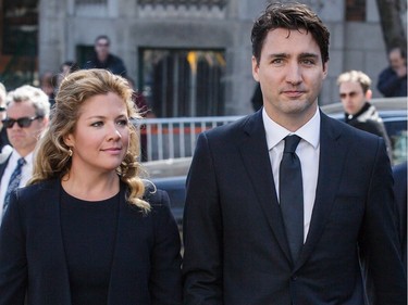 Justin Trudeau and Sophie Grégoire-Trudeau arrive for a funeral ceremony
