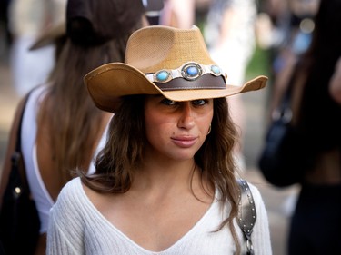 A woman in a cowboy hat at Osheaga.