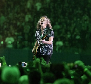 Kirk Hammett plays the guitar during a Metallica concert