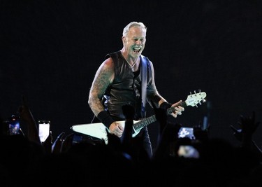 James Hetfield plays the guitar during a Metallica concert