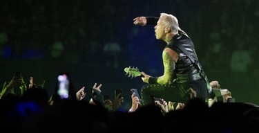 James Hetfield gesticulates at the crowd during a Metallica concert