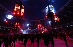 The Olympic Stadium is lit up in red during a Metallica concert