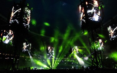 The Olympic Stadium is lit up in green during a Metallica concert