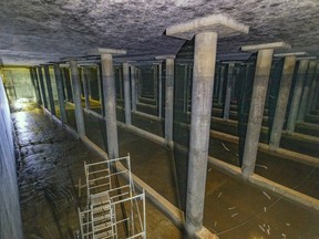 A large underground space is shown with dozens of support columns.