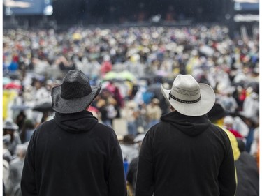People watch a performance at the Lasso country-music festival at Parc Jean-Drapeau in Montreal on Saturday, Aug. 19, 2023.