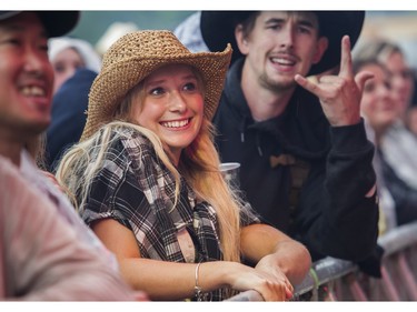People enjoy the music of Elle King at the Lasso country-music festival at Parc Jean-Drapeau in Montreal on Saturday, Aug. 19, 2023.