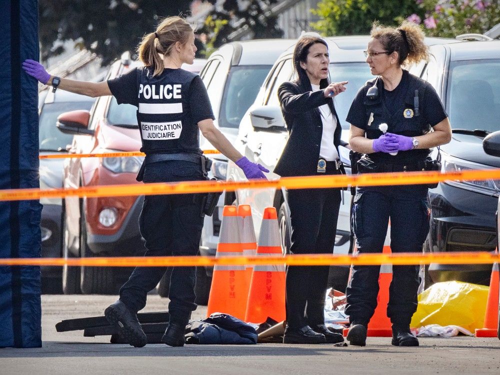 Montreal police investigators at the scene on Monday morning. A 911 call reporting gunshots in the area was made around 12:10 a.m.