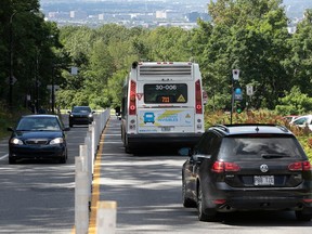 Cars and buses travel along Camillien-Houde Way