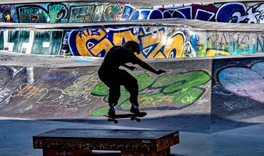 skateboarder Lachlan Roch practises his moves at graffiti-covered Van Horne skateboard park at St-Laurent Blvd.