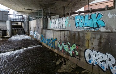 Graffiti artists crawled over the fenced-off area at the Peel Basin sluice gate to tag the concrete water basin.